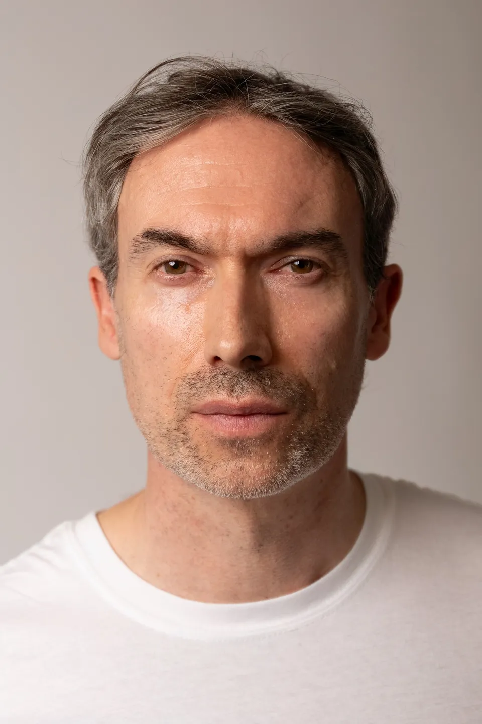 Kieron C, headshot, white tee